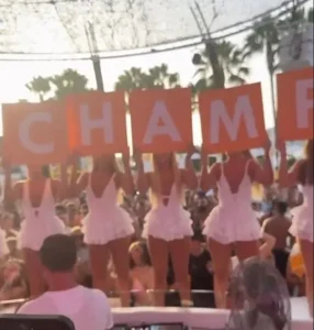 Dancers held up letters spelling 'World Champ' to mark Palmer's appearance